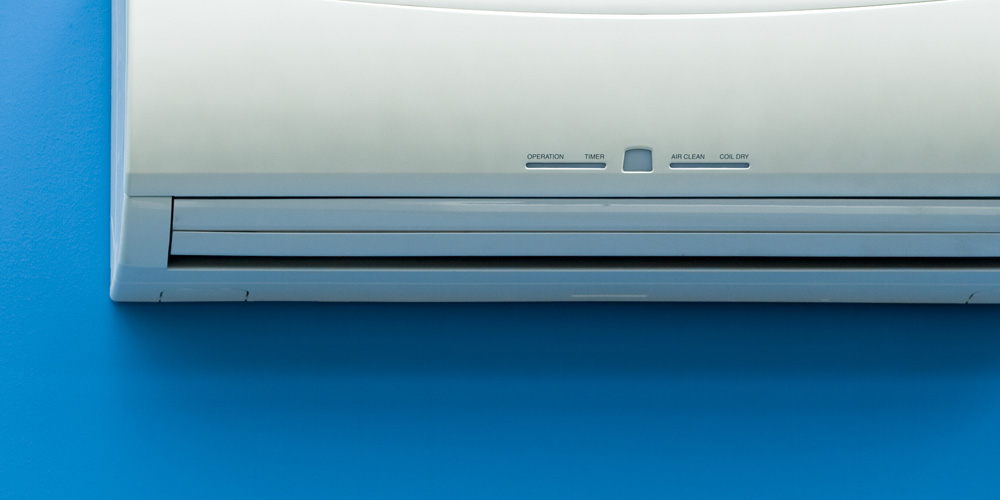 Ductless AC unit on blue wall